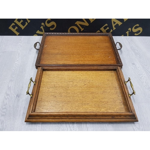 169 - A VICTORIAN OAK TWIN HANDLED SERVING TRAY PLUS ONE OTHER TWIN HANDLED SERVING TRAY