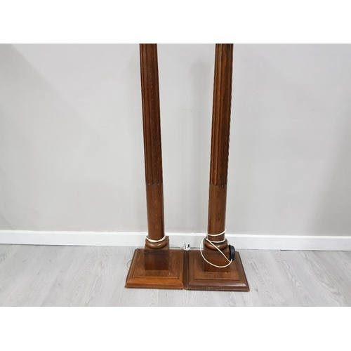 171 - A PAIR OF EARLY 20TH CENTURY OAK STANDARD LAMPS ON THE FORM OF COLUMNS 127CM