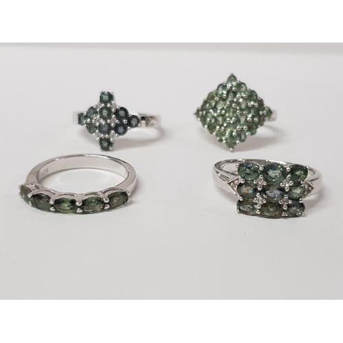 186 - FOUR SILVER AND GREEN STONE RINGS OF VARIOUS DESIGNS STAMPED SIZES R 1/2 AND T 1/2 18.1 G GROSS