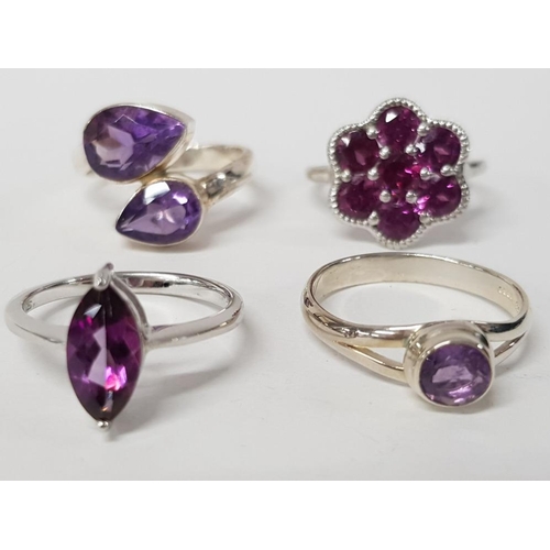 241 - FOUR SILVER AND PURPLE STONE RINGS STAMPED SIZES R 1/2 T 1/2 AND U 15.8G GROSS