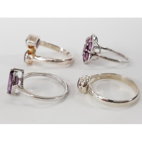 241 - FOUR SILVER AND PURPLE STONE RINGS STAMPED SIZES R 1/2 T 1/2 AND U 15.8G GROSS