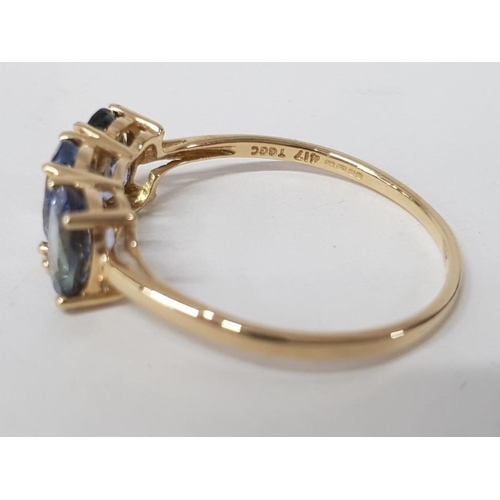 242 - A 9CT YELLOW GOLD AND BLUE STONE RING T 1/2 1.9G GROSS