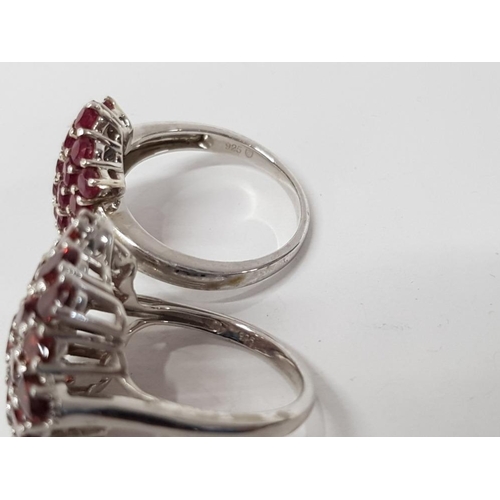 25 - TWO SILVER RINGS WITH RED AND PINK STONES STAMPED SIZES R 1/2 AND U 14.2G GROSS