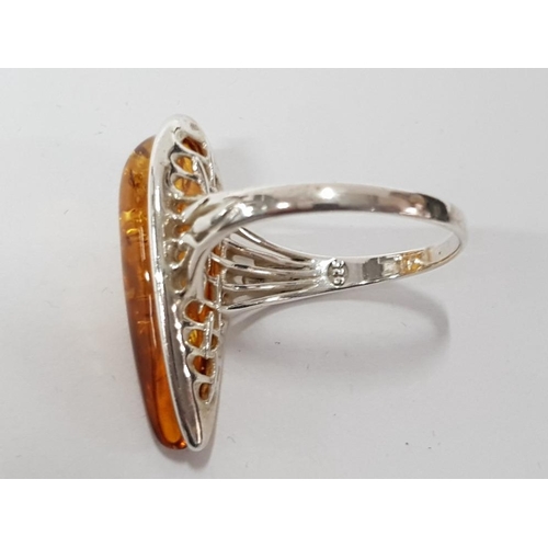 26 - A SILVER AND AMBER RING STAMPED SIZE R 1/2 4G GROSS