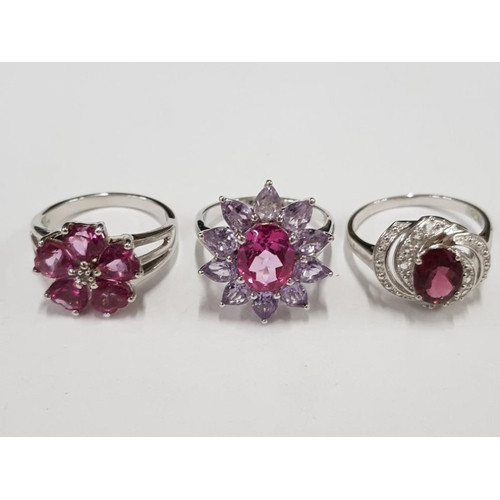 297 - THREE SILVER AND PINK STONE RINGS STAMPED SIZES R 1/2 AND U 14.9G GROSS