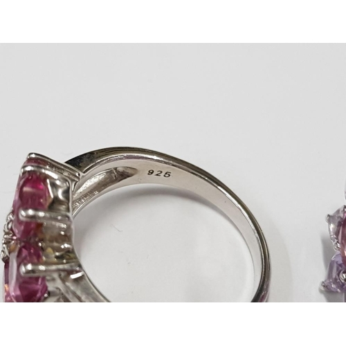 297 - THREE SILVER AND PINK STONE RINGS STAMPED SIZES R 1/2 AND U 14.9G GROSS