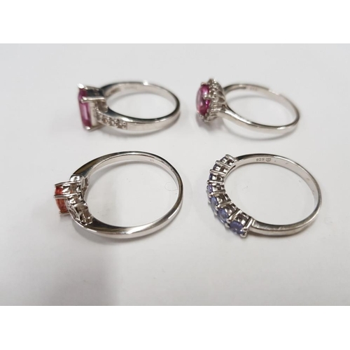 298 - FOUR SILVER PINK ORANGE AND PURPLE STONE RINGS STAMPED SIZES R 1/2 T 1/2 AND U 12.7G GROSS