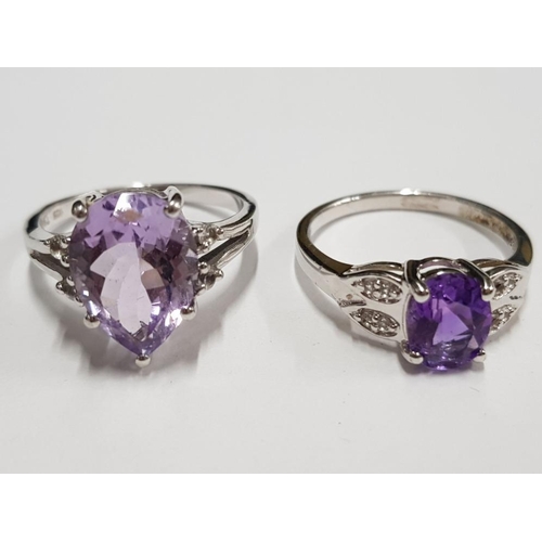 299 - TWO SILVER AND PURPLE STONE RINGS STAMPED SIZE R 1/2 7G GROSS