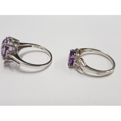 299 - TWO SILVER AND PURPLE STONE RINGS STAMPED SIZE R 1/2 7G GROSS