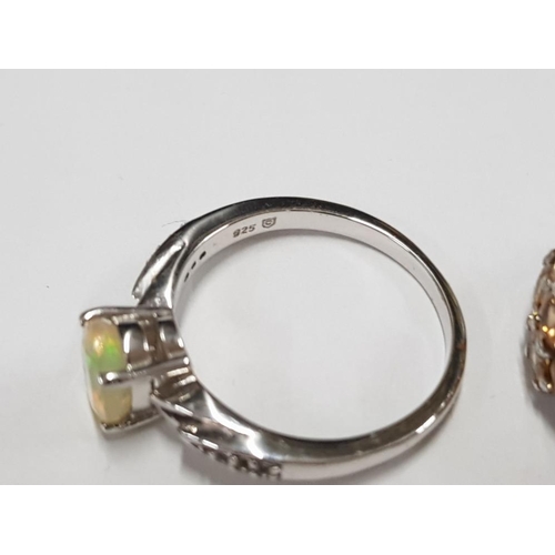 300 - THREE SILVER AND YELLOW STONE RINGS STAMPED SIZES R 1/2 AND T 1/2 11.2G GROSS