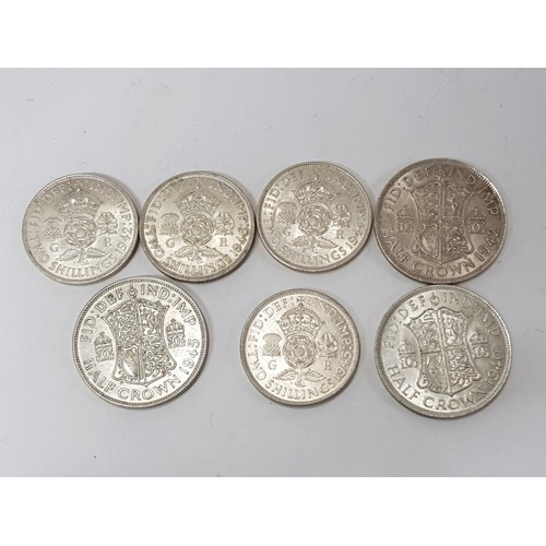 76 - 7 SILVER COINS INCLUDES 3 SILVER HALF CROWNS DATED 1940, 1942 AND 1945 ALSO INCLUDES FLORINS DATED 1... 