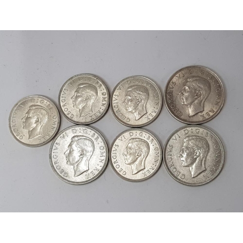 76 - 7 SILVER COINS INCLUDES 3 SILVER HALF CROWNS DATED 1940, 1942 AND 1945 ALSO INCLUDES FLORINS DATED 1... 