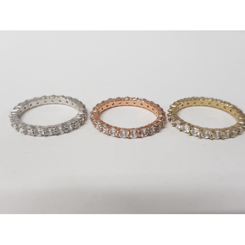 9 - THREE SILVER AND CZ FULL ETERNITY RINGS ALL SIZE T 9.6G GROSS