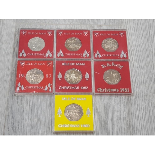 152 - ISLE OF MAN 50P CHRISTMAS COINS 1980 TO 1986 ALL DIFFERENT COINS IN EXCELLENT CONDITION HOUSED IN IN... 