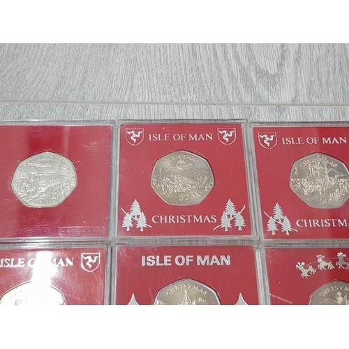 152 - ISLE OF MAN 50P CHRISTMAS COINS 1980 TO 1986 ALL DIFFERENT COINS IN EXCELLENT CONDITION HOUSED IN IN... 