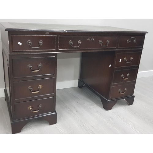 256 - A REPRODUCTION MAHOGANY LEATHER TOPPED DESK
