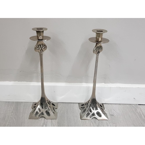 66 - ARTS AND CRAFTS STYLE PAIR OF CAST AND POLISHED WHITE METAL CANDLESTICKS