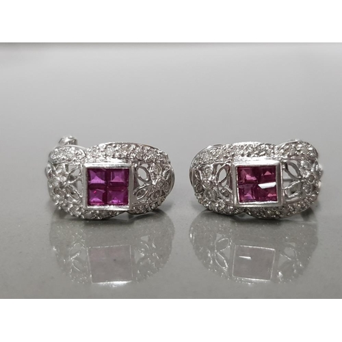 400 - 18CT WHITE GOLD RUBY AND DIAMOND CULF EARRING FEATURING 4 PRINCESS CUT RUBY'S SET IN THE CENTRE WITH... 