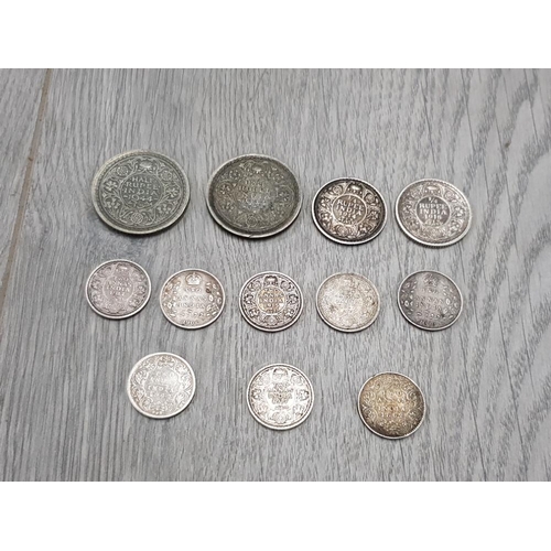 16 - SILVER EARLY INDIA COINS TO INCLUDE 2 1944 1/2 RUPEES 2 1/4 RUPEES AND 8 ZANNAS PRE 1918 INCLUDING V... 