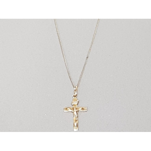 22 - 9CT YELLOW GOLD CRUCIFIX 3CMS WITH BALE 0.7G ON SILVER GILT 18" CHAIN