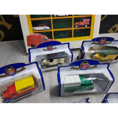 31 - COLLECTION OF OXFORD DIECAST VEHICLES IN BOX AND A GLASS FRONTED DISPLAY CABINET AS NEW