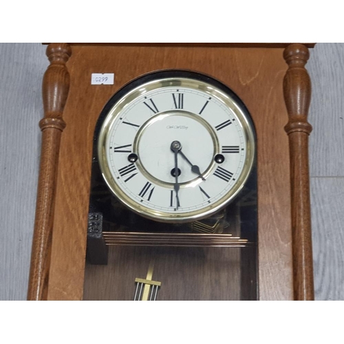 137 - WM WIDDOP PENDULUM WALL CLOCK WITH KEY