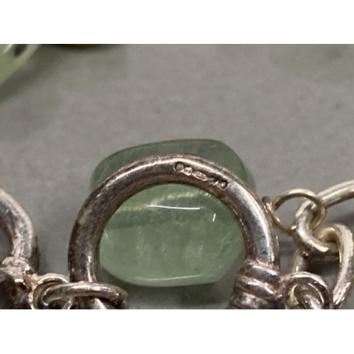 68 - SILVER LINK BRACELET WITH GREEN GEMSTONE CHARMS