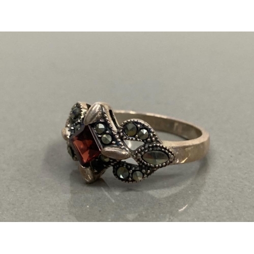 80 - SILVER GARNET AND MARCASITE RING SIZE 3 4.7G GROSS