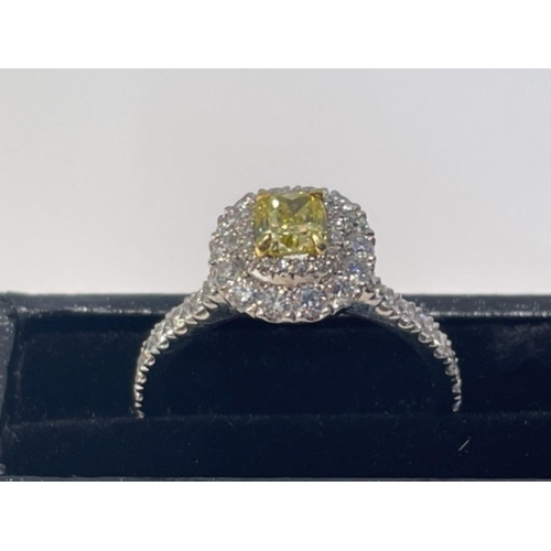 96 - NATURAL FANCY VIVID YELLOW DIAMOND RING 0.50CT CUSHION CUT IN PLATINUM WITH 2 LEVEL DIAMOND HALO IGI... 