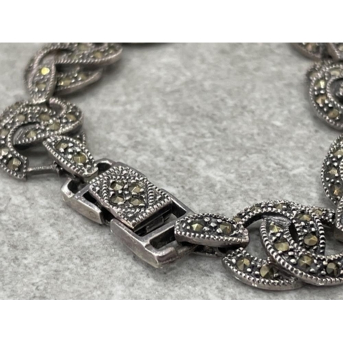 129 - SILVER AND MARQUESITE ORNATE CROSSOVER LINK BRACELET