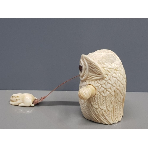 343 - CARVED BONE TAPE MEASURE IN THE FORM OF AN OWL WITH A MOUSE IN ITS MOUTH