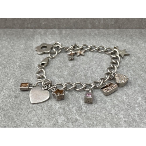 396 - SILVER ASSORTED CHARM BRACELET 24.8G