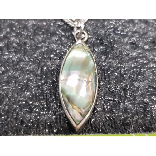 28 - SILVER MOUNTED PAUA SHELL PENDANT ON 18