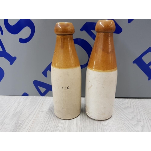 379 - 2 STONEWARE BOTTLES INCLUDES W.B. REID AND CO LD NEWCASTLE ON TYNE  NOURISHING STOUT AND EXTRA DOUBL... 