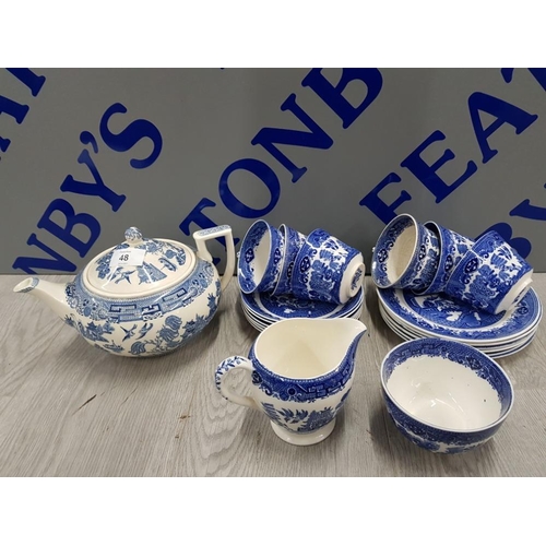 48 - 21 PIECES OF BLUE AND WHITE WILLOW PATTERN INCLUDES TEA POT, MILK JUG, CUPS, SUGAR BOWL AND PLATES