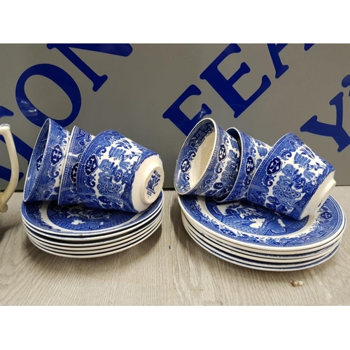 48 - 21 PIECES OF BLUE AND WHITE WILLOW PATTERN INCLUDES TEA POT, MILK JUG, CUPS, SUGAR BOWL AND PLATES