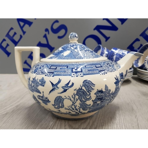 48 - 21 PIECES OF BLUE AND WHITE WILLOW PATTERN INCLUDES TEA POT, MILK JUG, CUPS, SUGAR BOWL AND PLATES