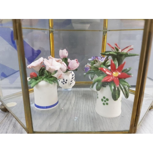 49 - GLASS DISPLAY TABLE CABINET WITH MINATURE PORCELAIN FLOWER FIGURES