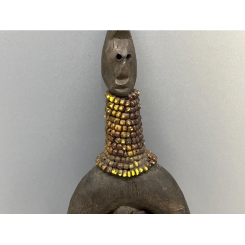 84 - AFRICAN NAMCHI NAMJI 20TH CENTURY FERTILITY DOLL WITH CARVINGS STUDS CLOTH AND BEAD NECKWARE