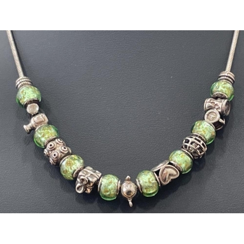 265 - SILVER SNAKE CHAIN WITH GREEN BEADS AND SILVER CHARMS