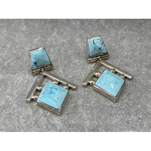 293 - SILVER TORQUE BANGLE WITH SQUARE STONE AND ORNATE EARRINGS SET WITH BLUE STONES