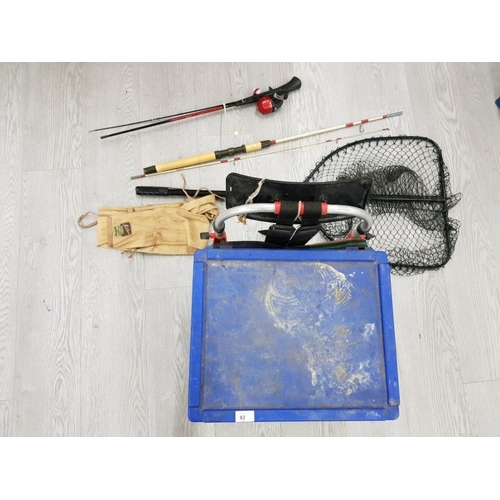 82 - 2 FISHING RODS ONE OF WHICH MILBRO WITH REEL, NET AND BAIT BOX WITH CONTENT