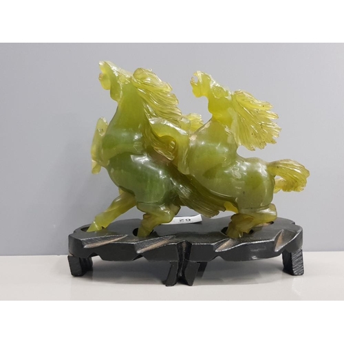 62 - DARK GREEN EAST ASIAN JADE CARVING OF 3 RUNNING HORSES ON STAINED BLACK BASE