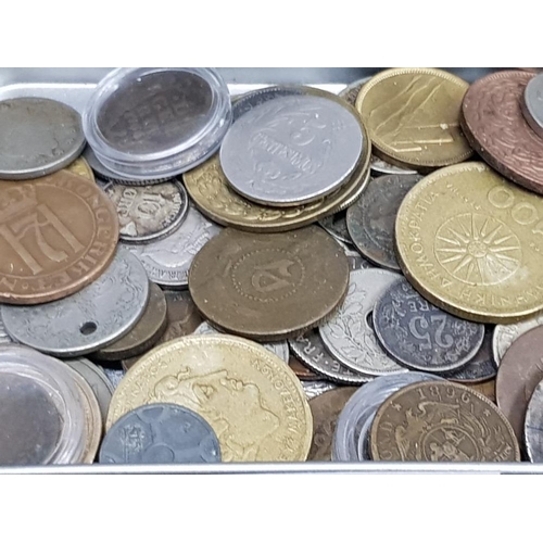 65 - TIN OF FOREIGN COINS SOME SILVER