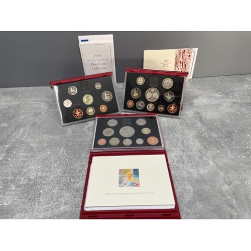 170 - 3 ROYAL MINT PROOF YEARLY COINS SETS DELUX RED 1995 1997 AND 1998 ORIGINAL CASES AND CERTIFICATES