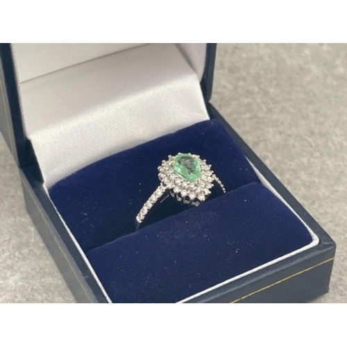 231 - 18CT WHITE GOLD PEAR SHAPE EMERALD WITH DOUBLE BORDER OF 36 DIAMONDS IN CLUSTER AND 10 DIAMONDS ON T... 