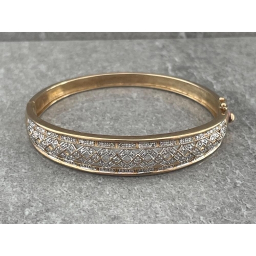 233 - 9CT GOLD HINGED BANGLE SET WITH 0.25CT DIAMONDS 19.4G