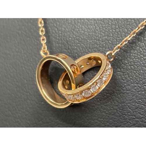 256 - CARTIER 18CT ROSE GOLD DIAMOND SET LINKED OVAL LOVE RING PENDANT AND CHAIN