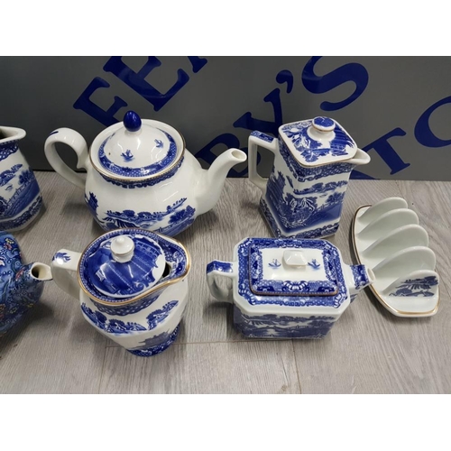 110 - COLLECTION OF RINGTONS TEA POTS AND MILK JUGS, ALSO TO INCLUDE CUP AND SAUCER AND TOAST RACK ETC