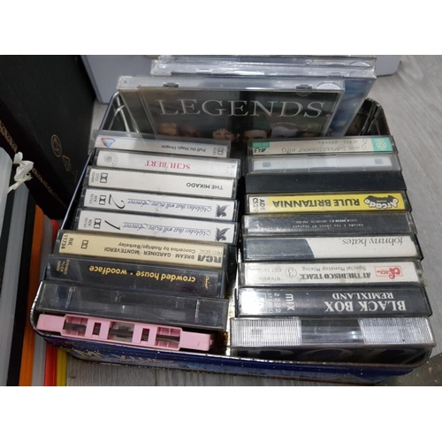 33 - LARGE COLLECTION OF CASSETTE TAPES, DVDS AND 3 VINTAGE RECORDS